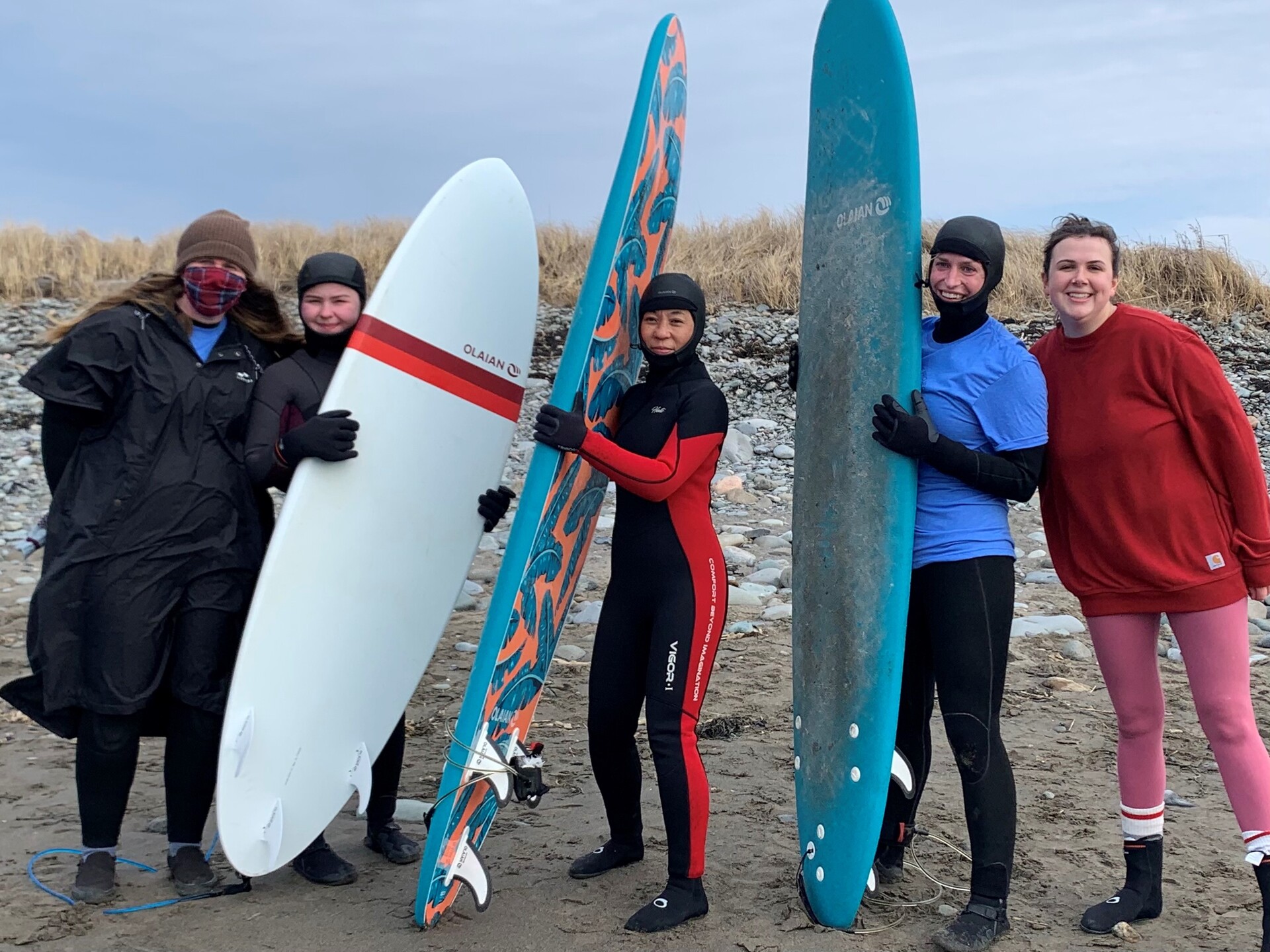 People Holding Surf Boards